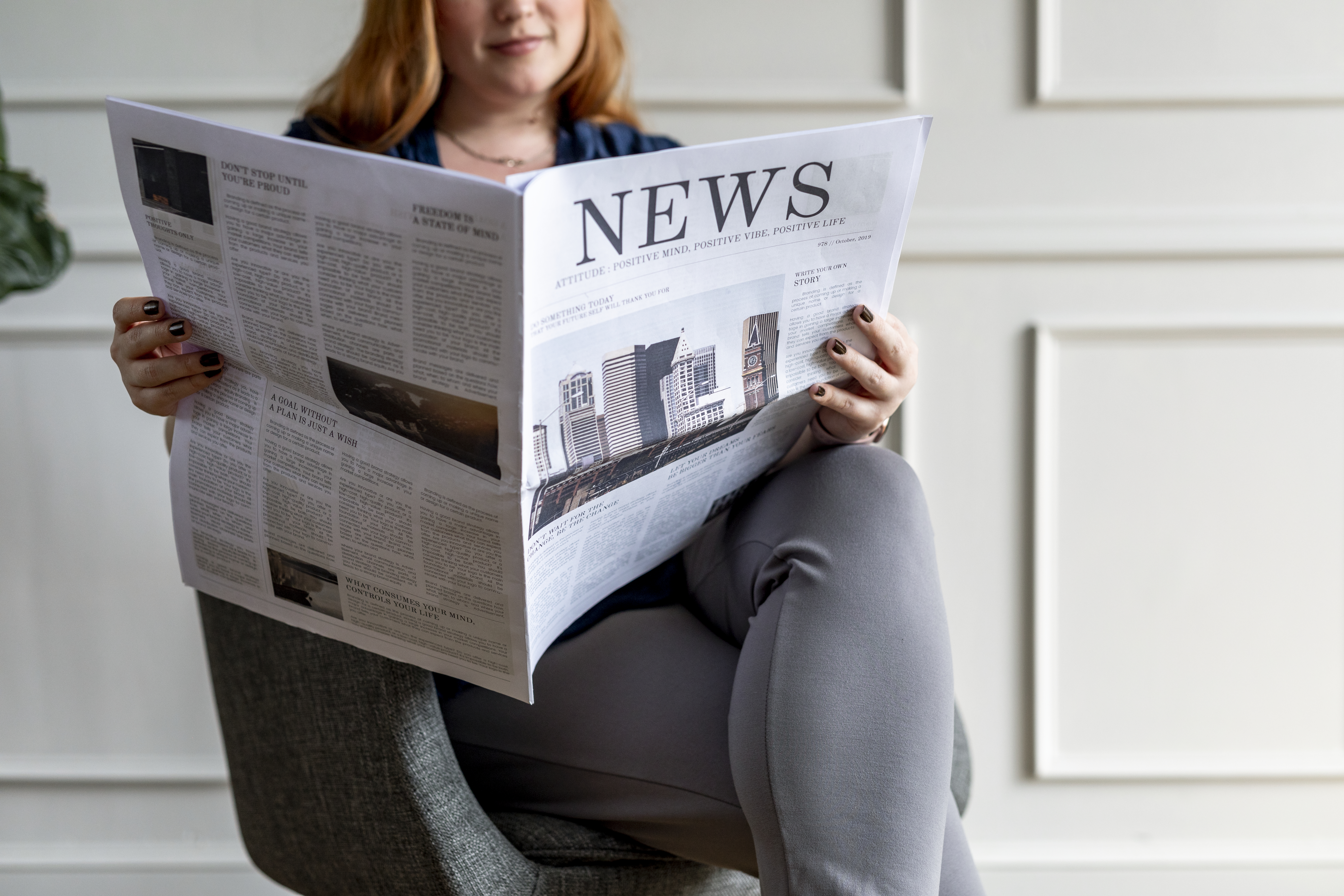 woman reading newspaper